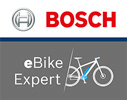 Se muestra un logotipo dividido en dos. La parte superior muestra el logotipo de Bosch y la inferior el logotipo de eBike Expert.